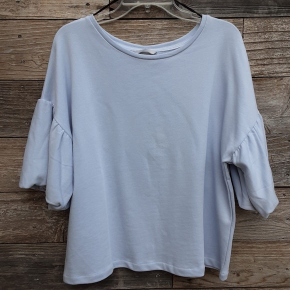 H&M Tops - H&M short sleeved light blue shirt size large NWT